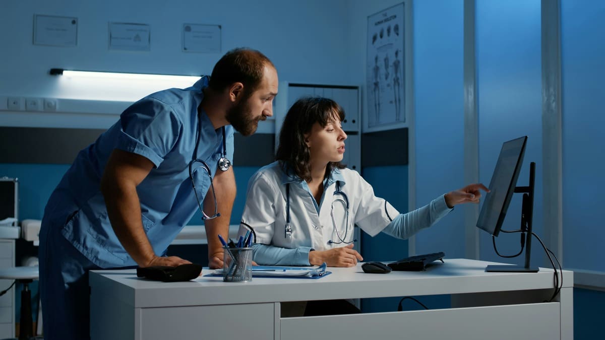 medical technicians reviewing medical monitoring